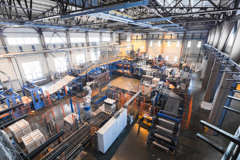 Fiberglass production industry equipment at manufacture background
